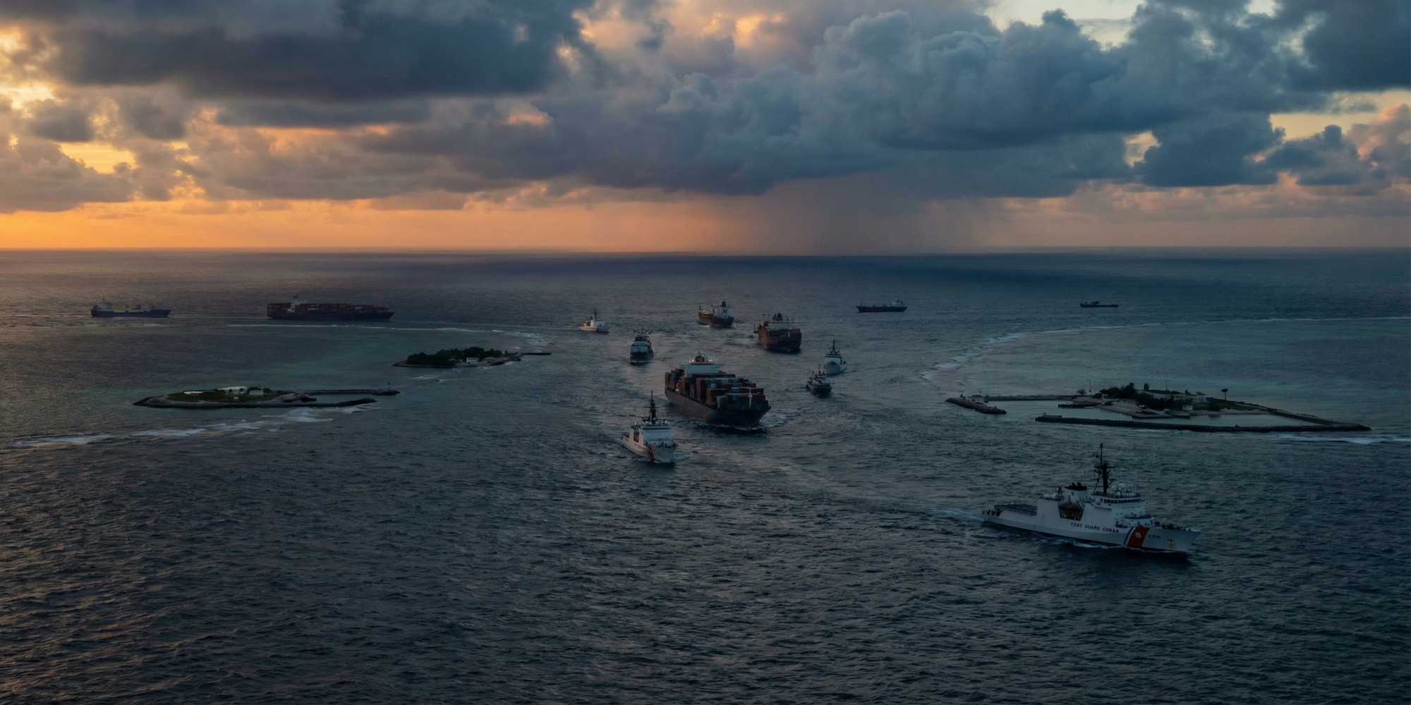 Aerial view of coast guard and cargo vessels near a contested reef in the South China Sea