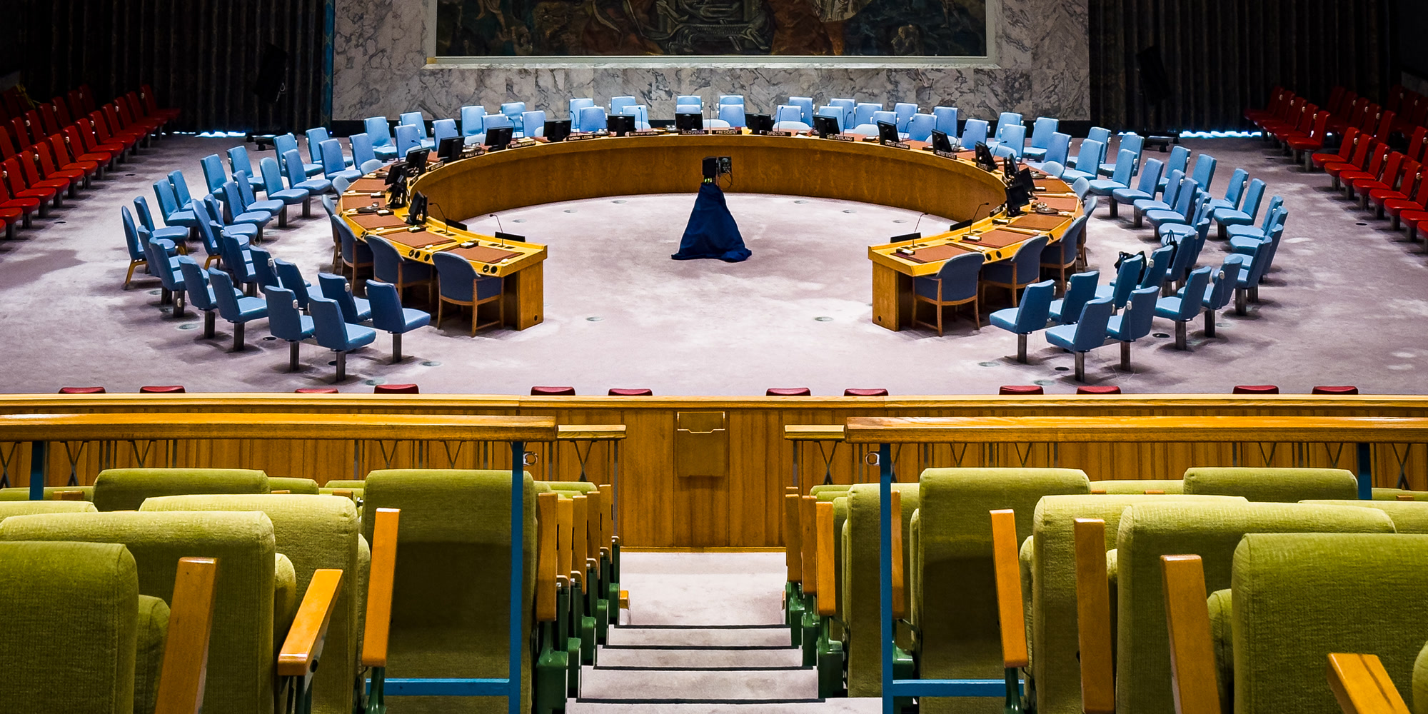 Delegates seated around the United Nations Security Council horseshoe table